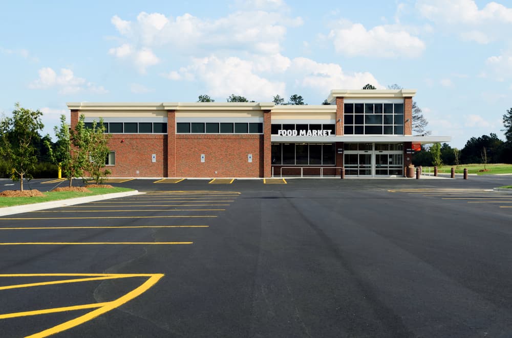 Brand new finished parking lot in front of FOOD MARKET