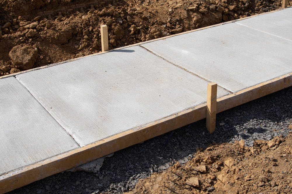 A newly paved sidewalk by Neyra Paving